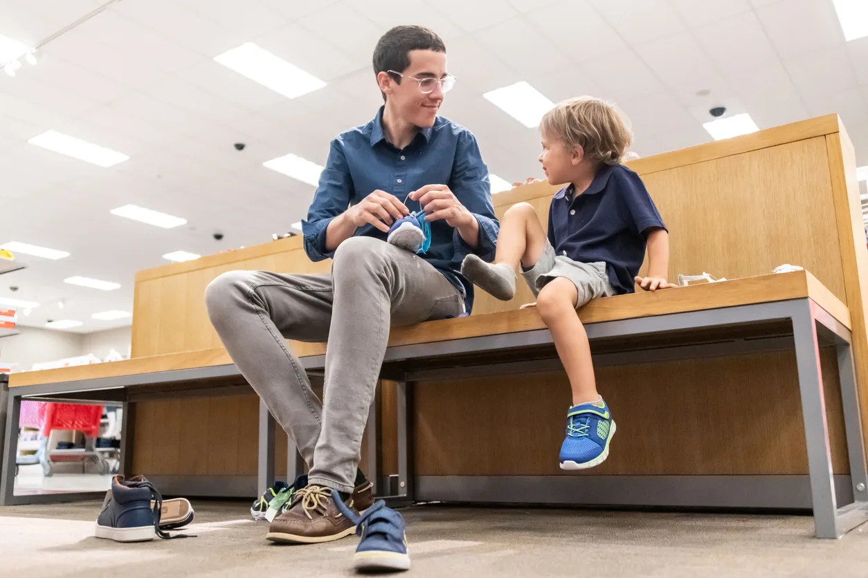 A young child trying on a well-fitting pair of shoes
