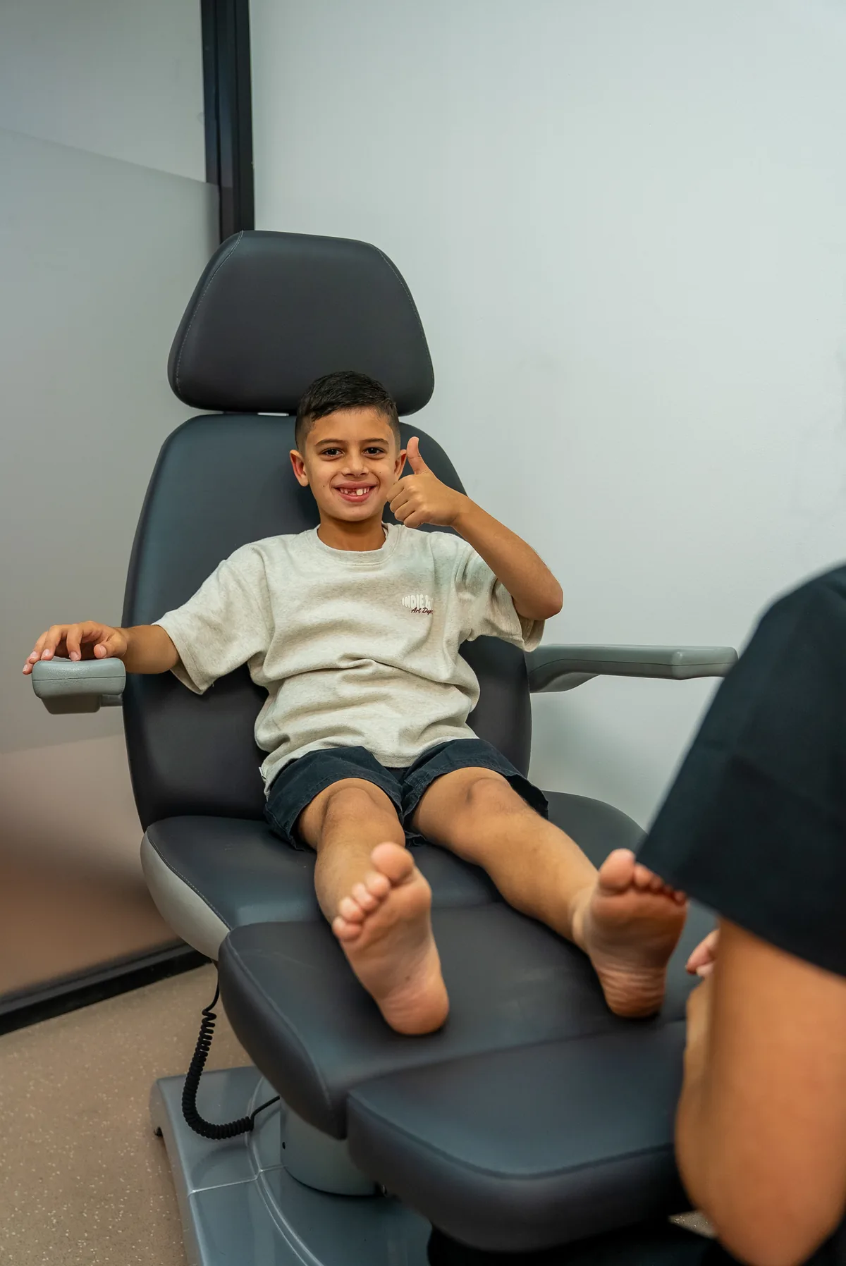 A young child having their feet gently checked at Bexley Podiatry